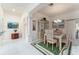 Well-lit dining room featuring tile floors, decorative columns, and bright light at 1875 Saybrook Way, The Villages, FL 32162