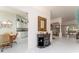 Open foyer with tile floors leading to the kitchen and living area at 1875 Saybrook Way, The Villages, FL 32162