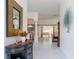 Open foyer with tile floors leading to the open living and dining area at 1875 Saybrook Way, The Villages, FL 32162