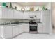 Well-maintained kitchen featuring stainless steel appliances and plentiful counter and cabinet space at 1875 Saybrook Way, The Villages, FL 32162