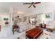 Spacious living room with tile floors, bright light, and comfortable seating at 1875 Saybrook Way, The Villages, FL 32162