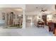 Open concept living area with tile flooring and views of the backyard at 1875 Saybrook Way, The Villages, FL 32162