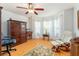 Comfortable office space with wood floors, a ceiling fan, and natural light from bay windows at 1875 Saybrook Way, The Villages, FL 32162