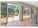 Bright sunroom with glass windows and a patio beyond, great for indoor-outdoor living, and relaxation at 1875 Saybrook Way, The Villages, FL 32162