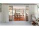 The sunroom offers abundant light and seating, perfect for relaxing or entertaining, with access to the patio at 1875 Saybrook Way, The Villages, FL 32162