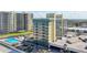 Aerial view showcasing the building and pool near the beach at 1909 S Atlantic Ave # 311312, Daytona Beach, FL 32118