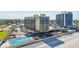 Aerial view featuring a pool near the beach at 1909 S Atlantic Ave # 311312, Daytona Beach, FL 32118