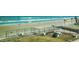 View of a sandy beach with ocean waves from a fenced in property at 1909 S Atlantic Ave # 311312, Daytona Beach, FL 32118