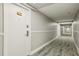 Long hallway with a door, neutral paint, and patterned flooring at 1909 S Atlantic Ave # 311312, Daytona Beach, FL 32118