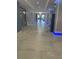 Bright hallway featuring tile floors, paneled columns with accent lighting, and several doorways at 1909 S Atlantic Ave # 311312, Daytona Beach, FL 32118