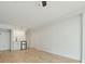 Bright living room featuring wood floors, ceiling fan, with a wet bar and closet at 1909 S Atlantic Ave # 311312, Daytona Beach, FL 32118