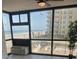 Living room with floor to ceiling windows and an ocean view at 1909 S Atlantic Ave # 311312, Daytona Beach, FL 32118