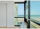 Living room with floor to ceiling windows and ocean view at 1909 S Atlantic Ave # 311312, Daytona Beach, FL 32118