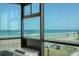 Living room with floor to ceiling windows and ocean view at 1909 S Atlantic Ave # 311312, Daytona Beach, FL 32118