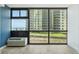 Ocean views from the living room window with a nearby building and green space at 1909 S Atlantic Ave # 311312, Daytona Beach, FL 32118