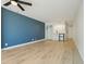 Bright living room featuring wood floors, ceiling fan, with a wet bar and closet at 1909 S Atlantic Ave # 311312, Daytona Beach, FL 32118