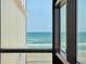 A captivating ocean view from a window, showing blue waters and a clear sky at 1909 S Atlantic Ave # 311312, Daytona Beach, FL 32118