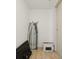 Storage room with ironing board and other items at 1909 S Atlantic Ave # 311312, Daytona Beach, FL 32118