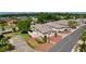 Aerial view of a lovely single-story home with decorative rock landscaping, lush lawn, and a private fenced yard at 2128 Alfredo Ave, Lady Lake, FL 32159