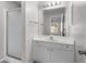 Clean bathroom with shower, white vanity, mirror, and ample lighting at 2128 Alfredo Ave, Lady Lake, FL 32159