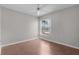 Well-lit bedroom with a window offering a view of the outdoors and ceiling fan at 2128 Alfredo Ave, Lady Lake, FL 32159