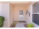 Inviting front entryway with decorative door and ample natural light at 2128 Alfredo Ave, Lady Lake, FL 32159