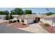Inviting single-story home featuring a two-car garage and a meticulously maintained yard with ornamental plantings at 2128 Alfredo Ave, Lady Lake, FL 32159