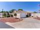 Charming single-story home with a well-manicured lawn and a two-car garage and beautifully landscaped front yard at 2128 Alfredo Ave, Lady Lake, FL 32159