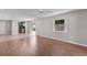Bright living room with wood flooring, neutral walls, and a window at 2128 Alfredo Ave, Lady Lake, FL 32159