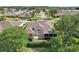Aerial shot of a well-maintained home nestled among mature trees in a quiet neighborhood at 2139 Kaylee Dr, The Villages, FL 32162