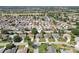 Suburban home with well-manicured lawns, and palm tree lined streets near a golf course at 2139 Kaylee Dr, The Villages, FL 32162