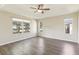 Bright, spacious bedroom with luxury vinyl floors, ceiling fan, and natural light at 2139 Kaylee Dr, The Villages, FL 32162