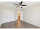 Bedroom with walk-in closet and ensuite bathroom featuring luxury vinyl floors at 2139 Kaylee Dr, The Villages, FL 32162