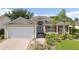 Charming single-story home featuring well-maintained landscaping, neutral colors, and a two-car garage at 2139 Kaylee Dr, The Villages, FL 32162