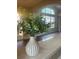 Bright interior with a view of a living room and laminate wood flooring, accented by a decorative vase at 2139 Kaylee Dr, The Villages, FL 32162