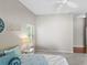 Bright bedroom showcasing neutral paint, carpet flooring, a ceiling fan, and a window that brings in natural light at 2293 Wayland St, The Villages, FL 32162