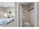 Bedroom featuring a peek to the walk-in closet, neutral walls, carpet flooring, and plenty of natural light at 2293 Wayland St, The Villages, FL 32162