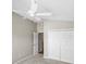 Carpeted bedroom featuring closet space and ceiling fan at 2293 Wayland St, The Villages, FL 32162