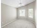 Sun-filled bedroom with carpet and dual windows at 2293 Wayland St, The Villages, FL 32162