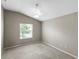 Carpeted bedroom with natural light from a window, and ceiling fan at 2293 Wayland St, The Villages, FL 32162