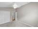 Carpeted bedroom featuring closet and adjoining doorway to other rooms at 2293 Wayland St, The Villages, FL 32162