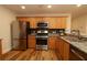 Well-equipped kitchen with stainless steel appliances and granite countertops offers ample space at 2449 Kingstree Pl, The Villages, FL 32162