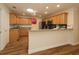 Modern kitchen featuring granite countertops, ample cabinet space, and stainless steel appliances at 2449 Kingstree Pl, The Villages, FL 32162
