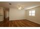 Inviting living space features hardwood floors, ample light, and seamless transitions to other areas at 2449 Kingstree Pl, The Villages, FL 32162