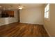 Spacious living area showcases hardwood floors, natural light, and an open layout into kitchen at 2449 Kingstree Pl, The Villages, FL 32162