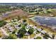 Charming home in a serene neighborhood, near a picturesque lake and lush greenery, shown in aerial view at 24802 Pine Hl, Leesburg, FL 34748