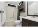 Cozy bathroom with a shower-tub combo, vanity, and tiled walls at 24802 Pine Hl, Leesburg, FL 34748