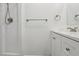 Bathroom featuring a walk-in shower and vanity with white cabinets at 24802 Pine Hl, Leesburg, FL 34748