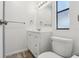 Updated bathroom featuring a modern vanity, toilet, and neutral color palette at 24802 Pine Hl, Leesburg, FL 34748