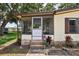 Charming screened-in porch with brick steps and decorative railing welcomes you to this lovely home at 24802 Pine Hl, Leesburg, FL 34748
